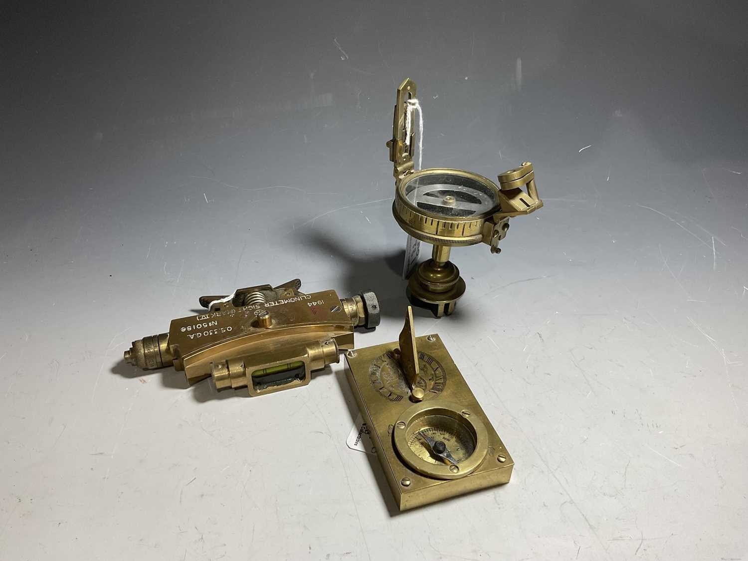 A brass bulkhead engine light and an Elliot Bros of The Strand tripod ...