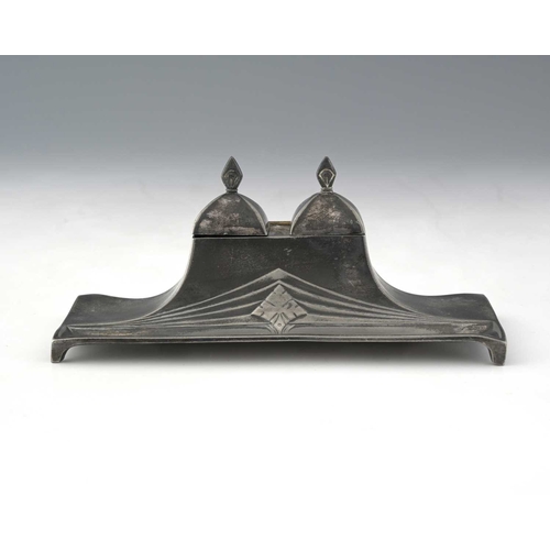 430 - WMF, a Jugendstil silver-plated double inkwell, model 47, twin lidded glass-lined ink wells on a swe... 