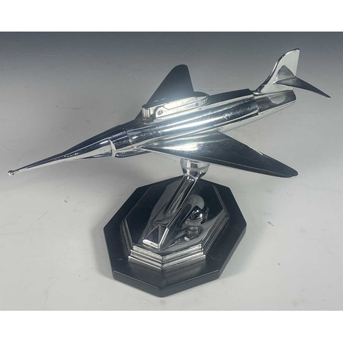 431 - A mid century chrome table lighter, formed to look like a fighter plane, raised on a ball hinge and ... 