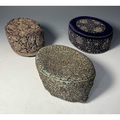 A group of six South Asian topi-type hats, mostly silk velvet and ...