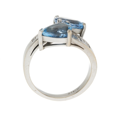 114 - An 18ct gold aquamarine and calibre-cut diamond crossover ring, estimated total aquamarine weight 3.... 