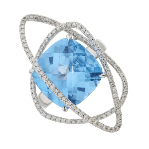115 - An 18ct gold blue topaz and diamond cocktail ring, estimated total diamond weight 0.60ct, H-I colour... 