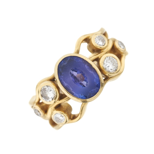 118 - An 18ct gold tanzanite and diamond dress ring, with brilliant-cut diamond accent undulating shoulder... 