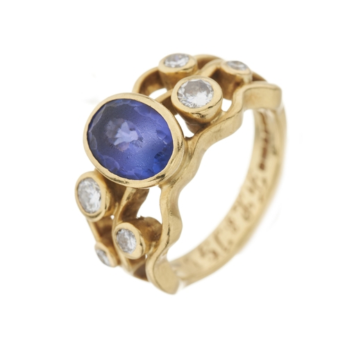 118 - An 18ct gold tanzanite and diamond dress ring, with brilliant-cut diamond accent undulating shoulder... 