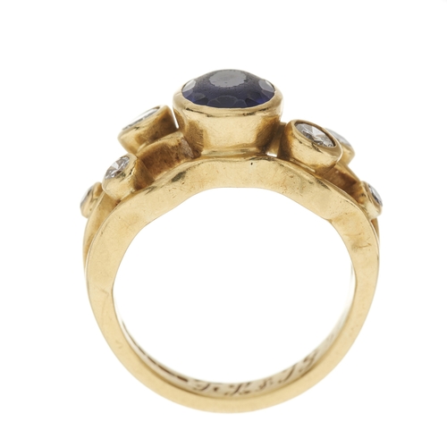 118 - An 18ct gold tanzanite and diamond dress ring, with brilliant-cut diamond accent undulating shoulder... 