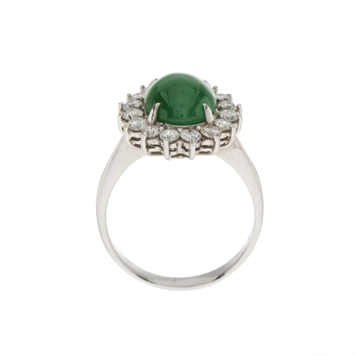 163 - An 18ct gold jade cabochon and brilliant-cut diamond cluster ring, jade measures approximately 10.4m... 