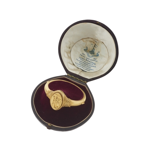 17 - John Brogden, a late Victorian Revivalist silver gilt bangle bracelet, maker's marks for John Brogde... 
