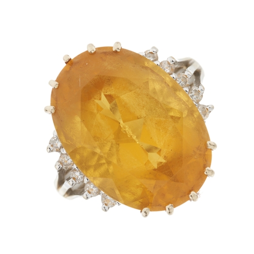179 - An 18ct gold citrine and diamond cocktail ring, citrine estimated weight 12.80ct, estimated total di... 