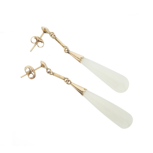 182 - A pair of gold white gem cabochon drop earrings, assessed as white jade, earring backs stamped K14 a... 