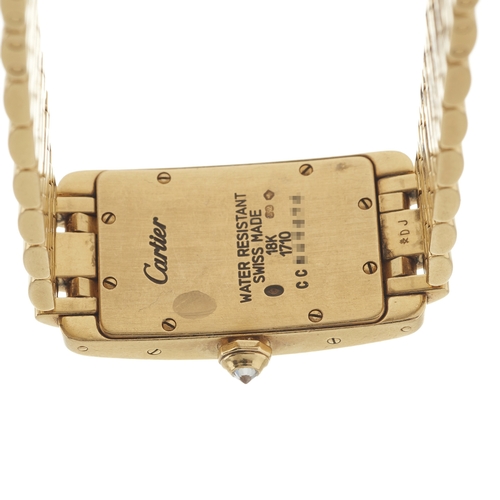 192 - 
Cartier 
A Tank Américaine bracelet watch
Case: Signed. 18ct gold. Common Control Mark. Reference 1... 