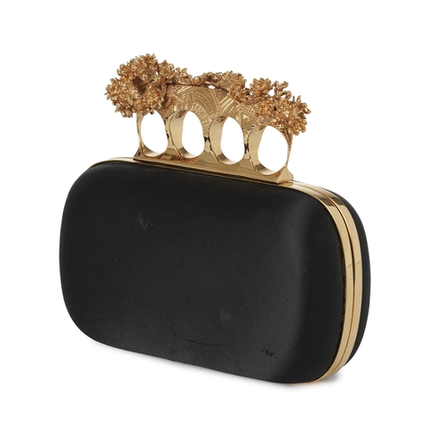 242 - Alexander McQueen, a Knuckle Box clutch, designed with a black satin exterior, featuring a gold-tone... 