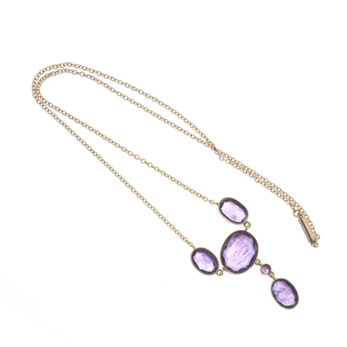 26 - A mid 20th century gold vari-shape amethyst drop necklace, with integral trace-link chain, principal... 