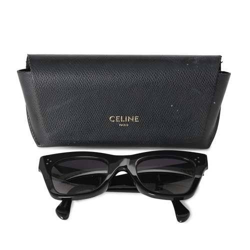268 - Celine, a pair of Catherine sunglasses, designed with shiny black acetate cat eye frames and grey ti... 