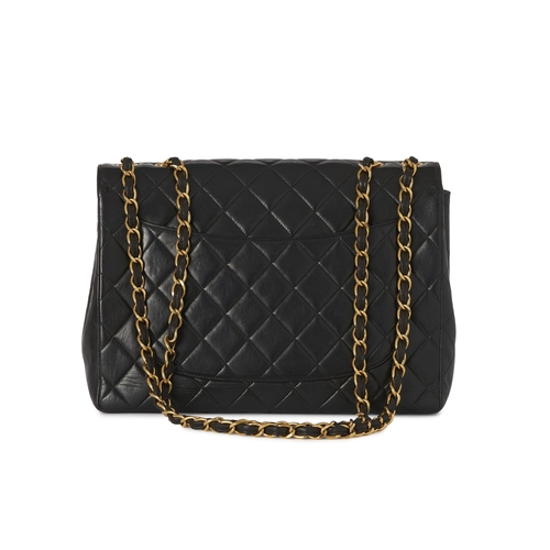 271 - Chanel, a vintage Jumbo Classic Flap handbag, crafted from black quilted lambskin leather, with 24k ... 