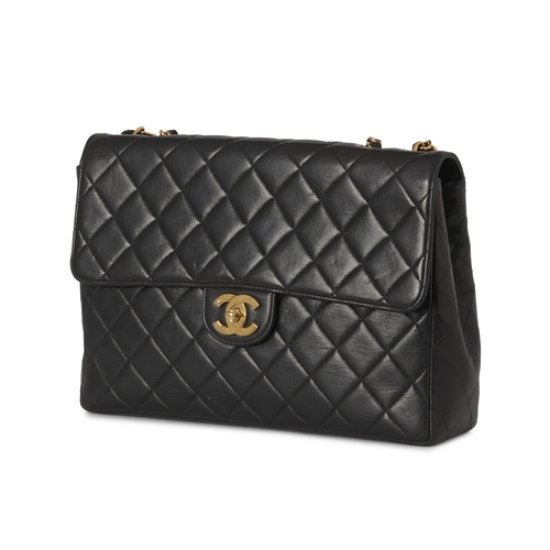 271 - Chanel, a vintage Jumbo Classic Flap handbag, crafted from black quilted lambskin leather, with 24k ... 