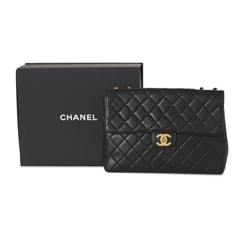 271 - Chanel, a vintage Jumbo Classic Flap handbag, crafted from black quilted lambskin leather, with 24k ... 