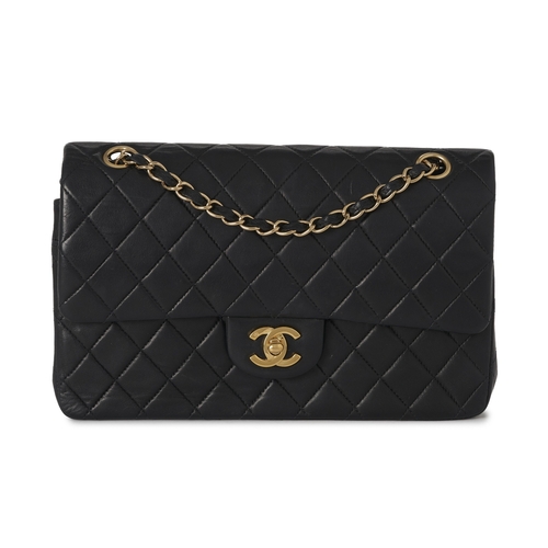 272 - Chanel, a vintage Medium Classic Double Flap handbag, designed with a diamond quilted black lambskin... 