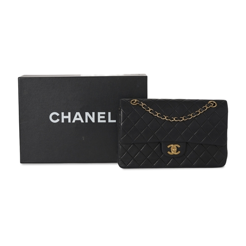 272 - Chanel, a vintage Medium Classic Double Flap handbag, designed with a diamond quilted black lambskin... 