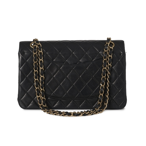 272 - Chanel, a vintage Medium Classic Double Flap handbag, designed with a diamond quilted black lambskin... 