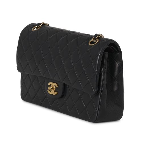 272 - Chanel, a vintage Medium Classic Double Flap handbag, designed with a diamond quilted black lambskin... 