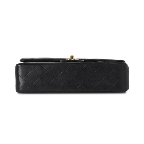 272 - Chanel, a vintage Medium Classic Double Flap handbag, designed with a diamond quilted black lambskin... 