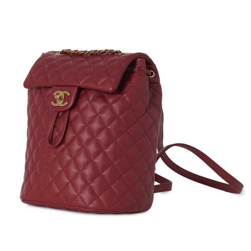 273 - Chanel, an Urban Spirit backpack, crafted from diamond quilted cherry red leather, with gold-tone ha... 