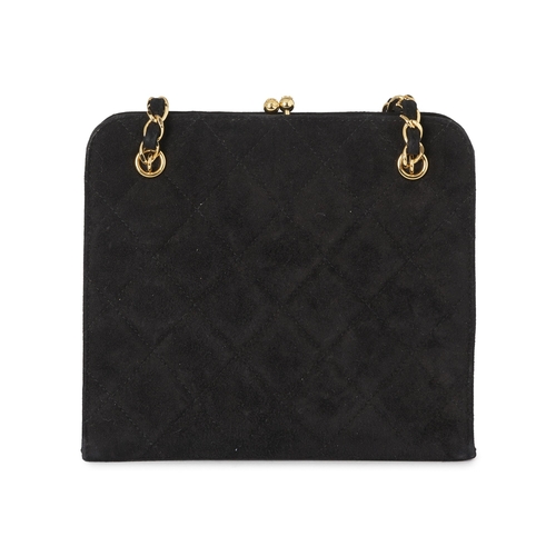 274 - Chanel, a vintage kiss-lock handbag, crafted from quilted black suede, with 24k gold-plated hardware... 
