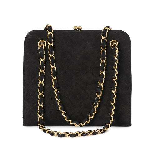 274 - Chanel, a vintage kiss-lock handbag, crafted from quilted black suede, with 24k gold-plated hardware... 