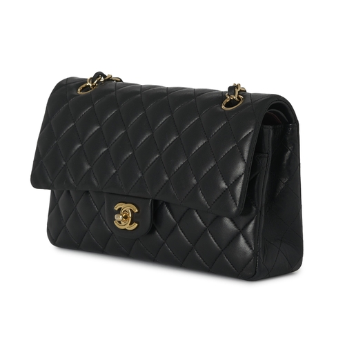 279 - Chanel, a Medium Classic Double Flap handbag, designed with a quilted black caviar leather exterior,... 