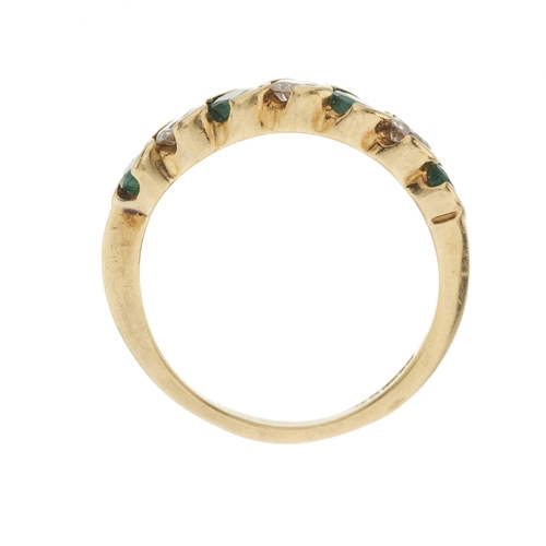 28 - An 18ct gold emerald and brilliant-cut diamond seven-stone ring, estimated total diamond weight 0.40... 