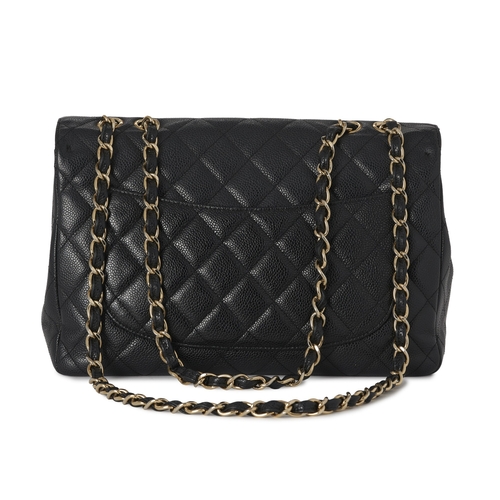 281 - Chanel, a Jumbo Classic Flap handbag, featuring a black caviar quilted leather exterior, with gold-t... 