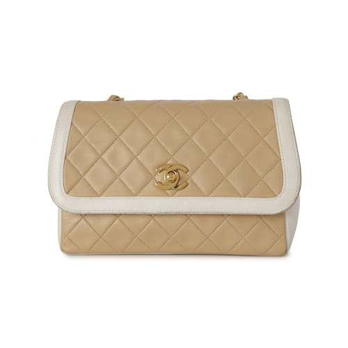 282 - Chanel, a vintage Diana Flap handbag with purse, crafted from black quilted cream leather, with whit... 