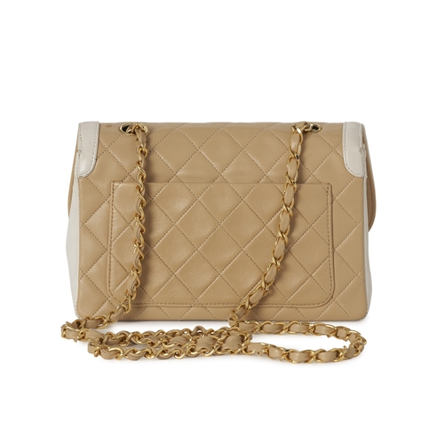 282 - Chanel, a vintage Diana Flap handbag with purse, crafted from black quilted cream leather, with whit... 