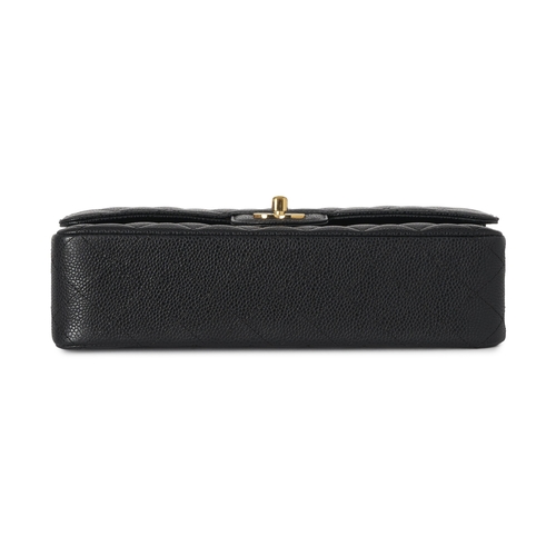 283 - Chanel, a Medium Classic Double Flap handbag, designed with a quilted black caviar leather exterior,... 