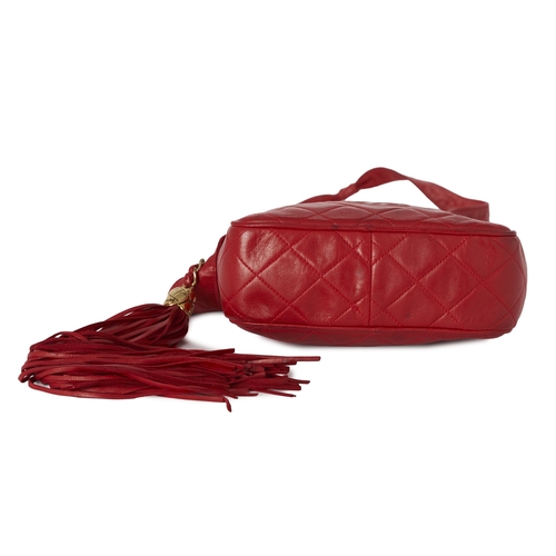 289 - Chanel, a vintage Tassel Camera bag, designed with a red quilted lambskin leather exterior, featurin... 