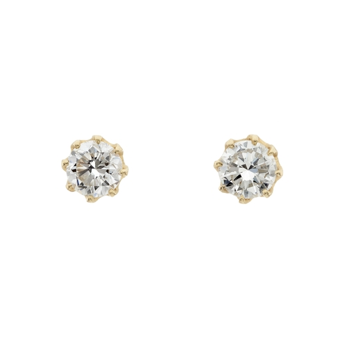 29 - A pair of gold brilliant-cut diamond single-stone stud earrings, estimated total diamond weight 0.80... 