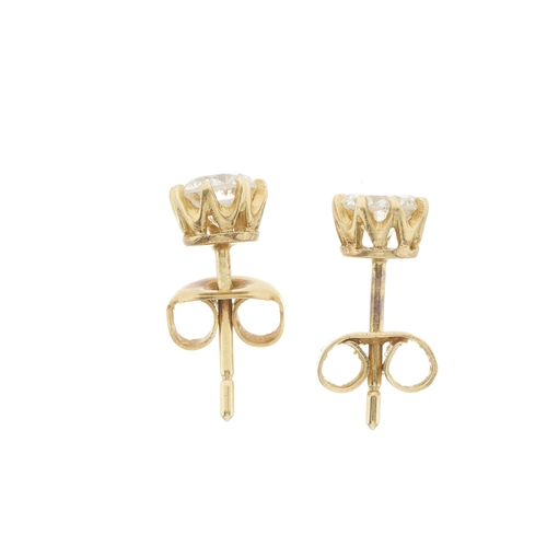 29 - A pair of gold brilliant-cut diamond single-stone stud earrings, estimated total diamond weight 0.80... 