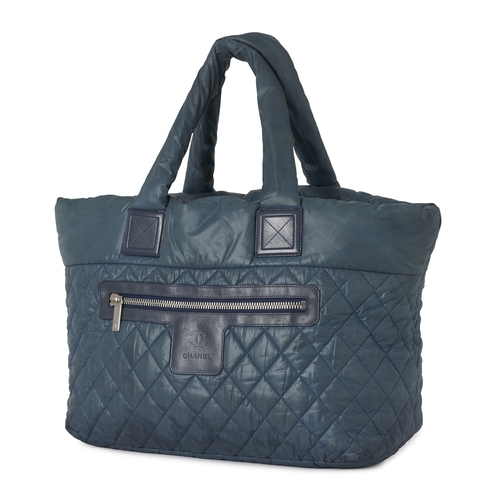 291 - Chanel, a large Coco Cocoon tote bag, designed with a diamond quilted, teal, nylon exterior, with bl... 
