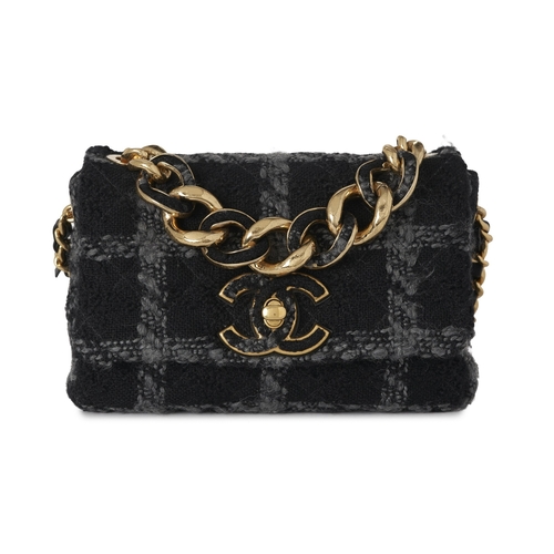 296 - Chanel, a Tweed 19 Flap handbag, featuring a black and grey tweed exterior, with gold-tone hardware,... 