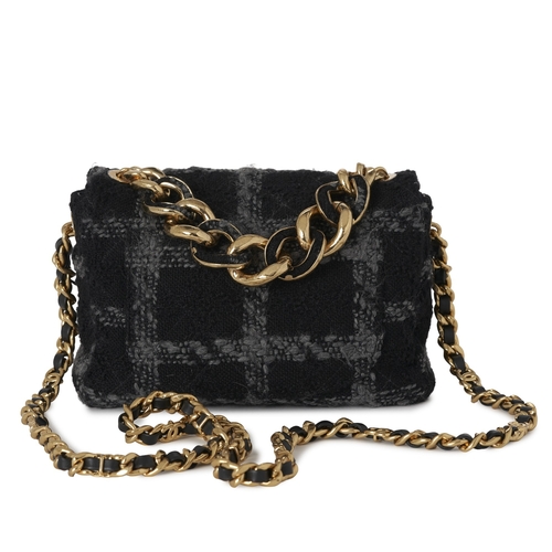 296 - Chanel, a Tweed 19 Flap handbag, featuring a black and grey tweed exterior, with gold-tone hardware,... 