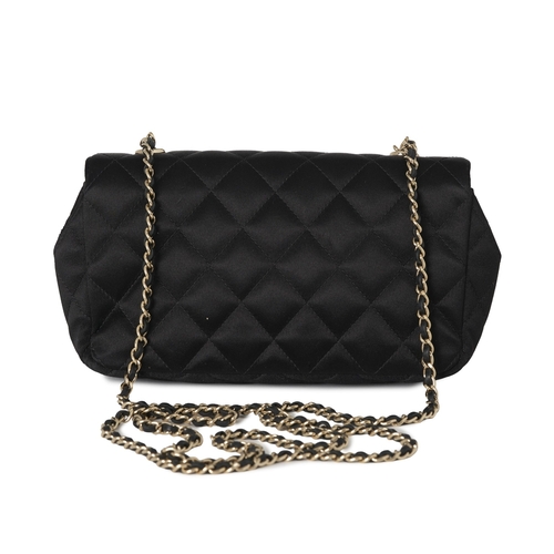 297 - Chanel, a satin Mini Flap handbag, crafted from quilted black satin, with gold-tone hardware, a long... 