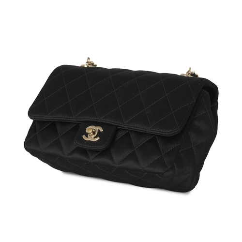 297 - Chanel, a satin Mini Flap handbag, crafted from quilted black satin, with gold-tone hardware, a long... 
