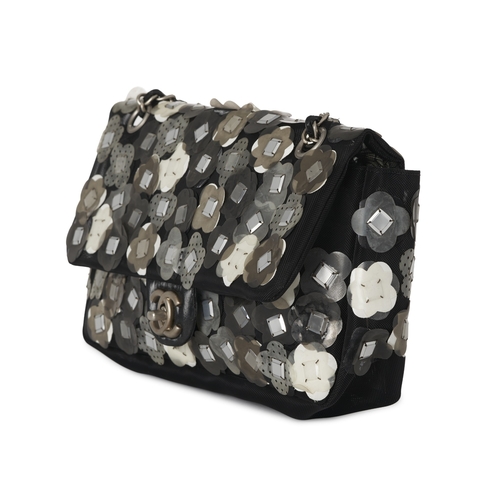 299 - Chanel, a mesh Paillette Flap handbag, featuring a black mesh exterior with floral paillette embelli... 