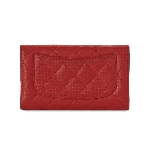 301 - Chanel, a quilted Classic Flap trifold wallet, featuring a perforated red leather exterior, with a r... 