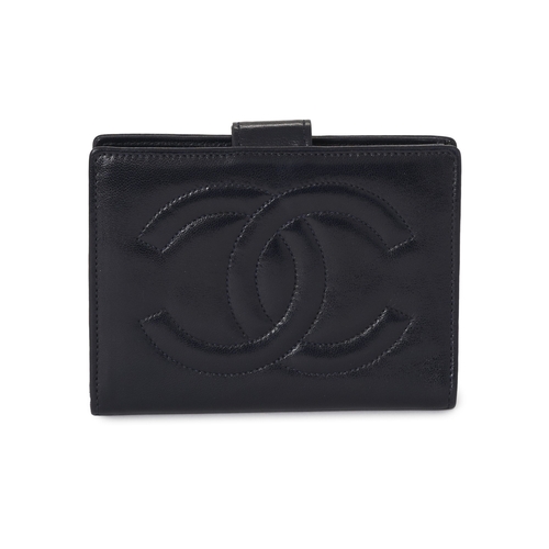303 - Chanel, a Compact French wallet, crafted from navy blue lambskin leather, with CC embroidered logo t... 
