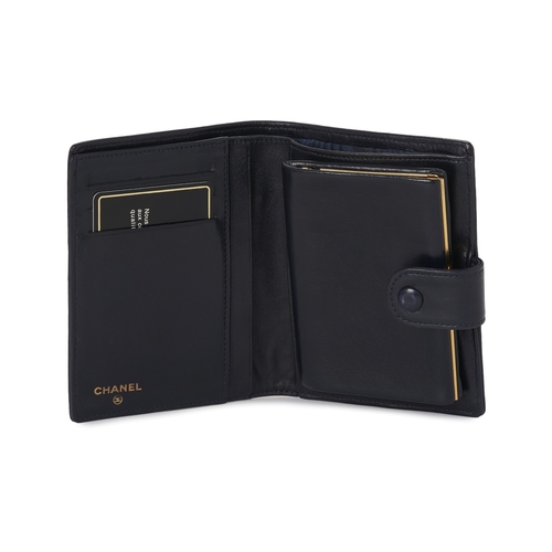 303 - Chanel, a Compact French wallet, crafted from navy blue lambskin leather, with CC embroidered logo t... 