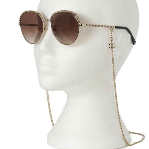 306 - Chanel, a pair of Pantos sunglasses with chain, featuring gold-tone metal frames, brown gradient len... 
