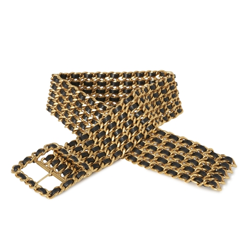 307 - Chanel, a vintage 1993 multi-strand chain belt, designed from gold-plated metal and black lambskin l... 