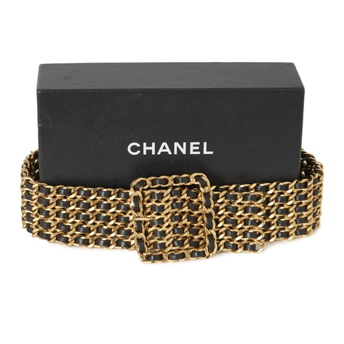 307 - Chanel, a vintage 1993 multi-strand chain belt, designed from gold-plated metal and black lambskin l... 
