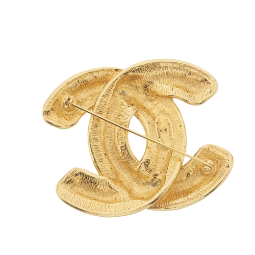 309 - Chanel, a vintage gold-tone quilted CC brooch pin, signed Chanel, stamped Made In France, length 5cm